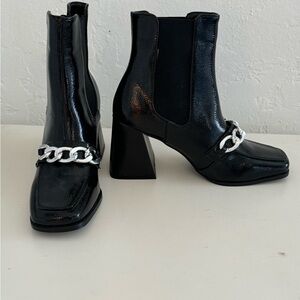 ASOS Raid Shiloh 4 faux leather chain ankle boots.